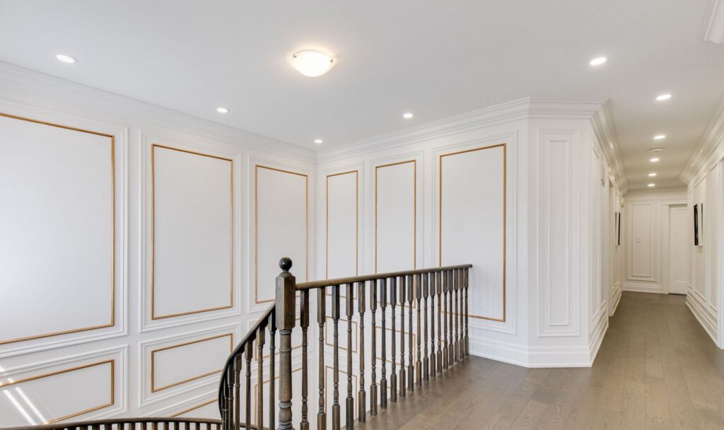 Gorgeous full wall wainscoting on a staircase and hallway in the house in King City