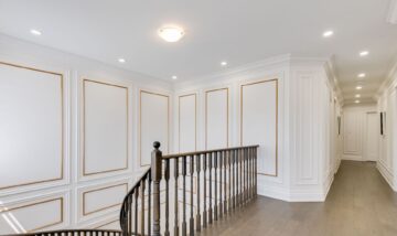 Gorgeous full wall wainscoting on a staircase and hallway in the house in King City