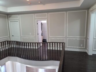 Full wall wainscoting, double level, in the hallway at the house in Vaughan