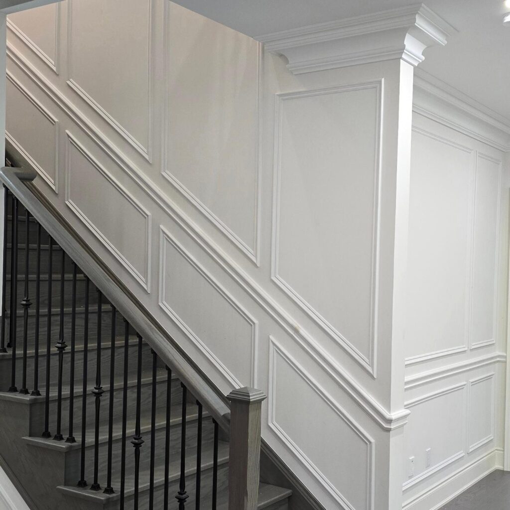 Full wall wainscoting, double level with chair rail on the staircase in Oakville, ON