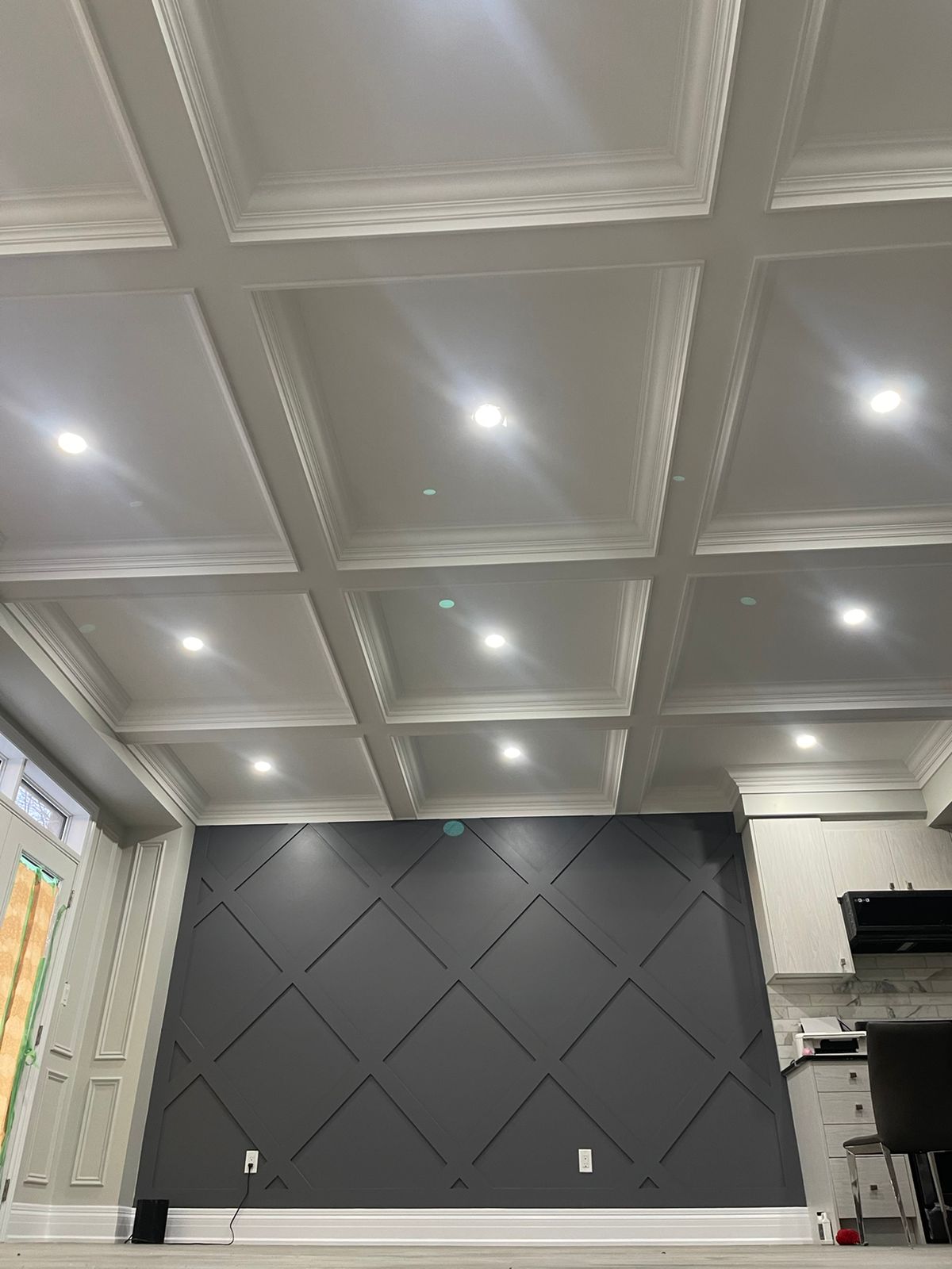 Traditional waffle ceiling and diamond shape accent wall in the house in King City, ON